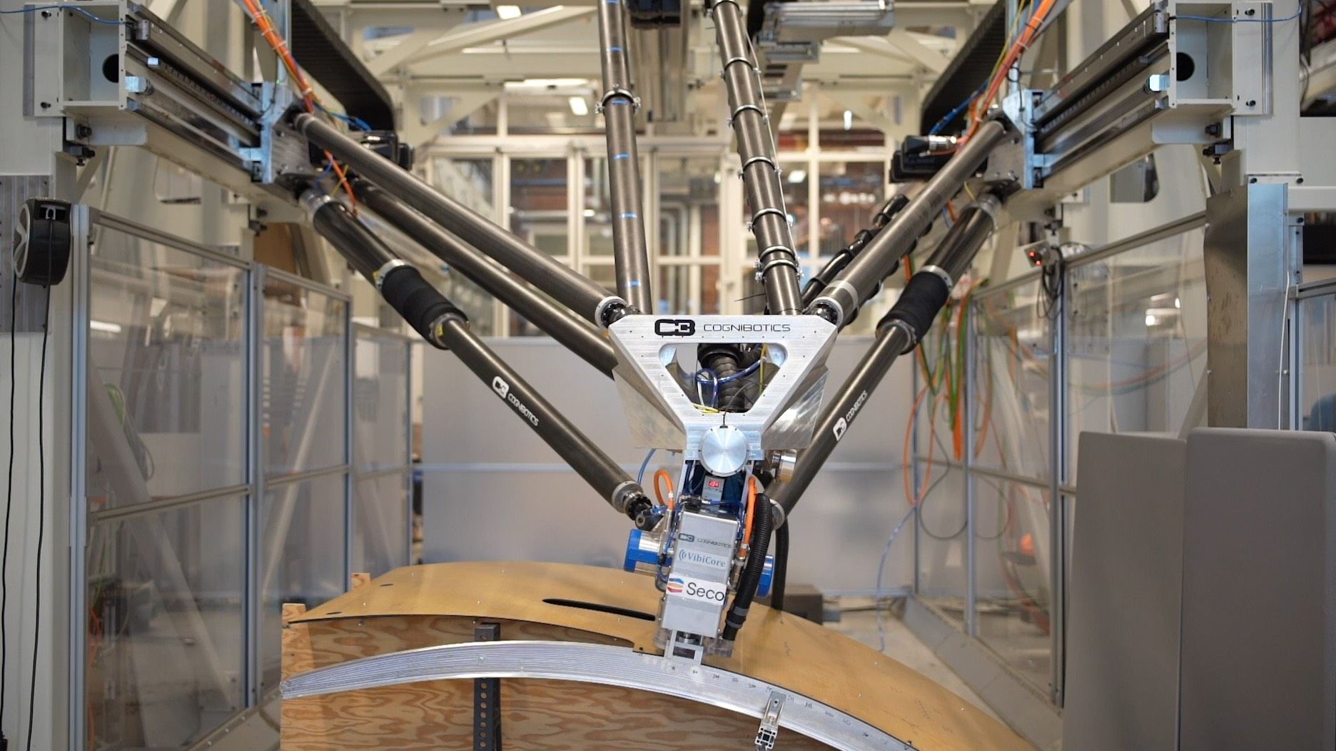 Robot cell manufacturing a large composite structure